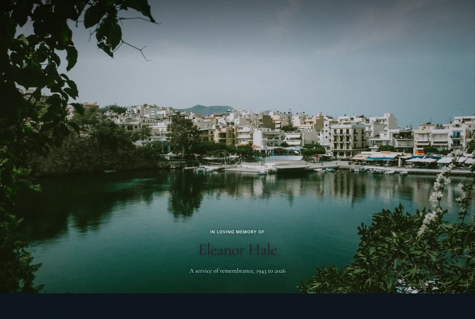 The opening of a memorial page: a photograph of a harbour town at dusk, and over it the words in loving memory of Eleanor Hale, a service of remembrance, 1943 to 2026.